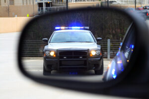  Photo of a police officer issuing a DUI resulting in a need for a Michigan drivers license reinstatement