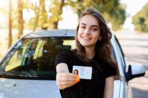 photo of a woman holding a license