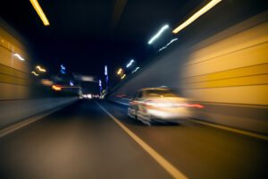 photo of a car driving down the road