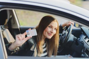 photo of a woman holding a license