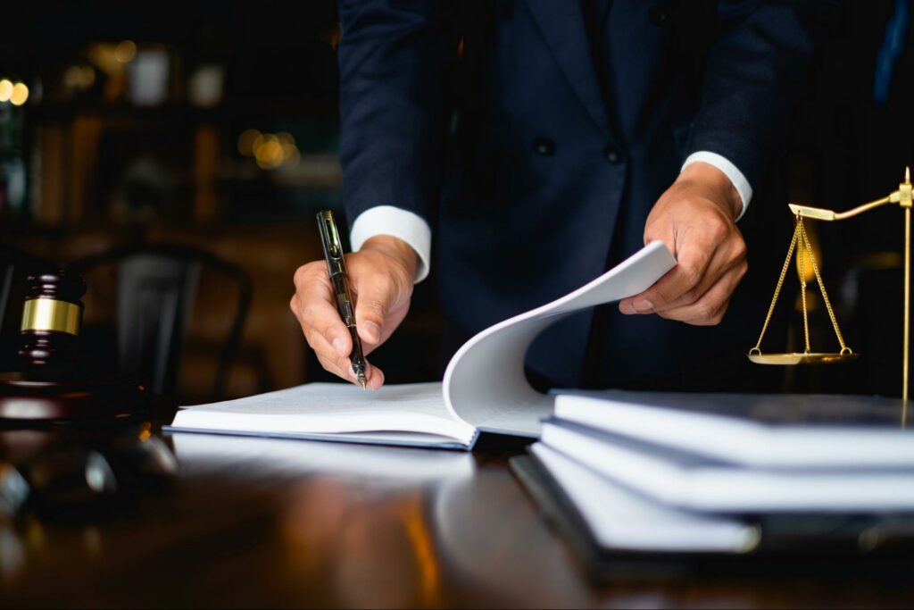 Lawyer writing notes in a notebook