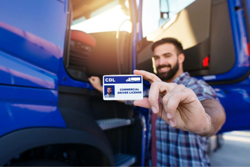 Man outside a commercial vehicle holding a commercial drivers license