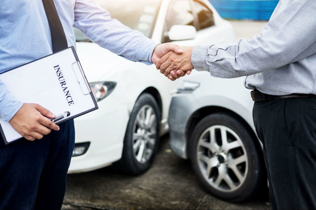 car insurance agent shaking hands with customer