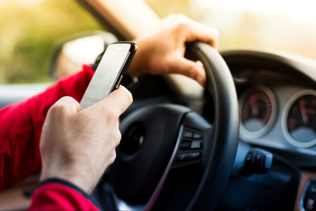 a person texting while driving