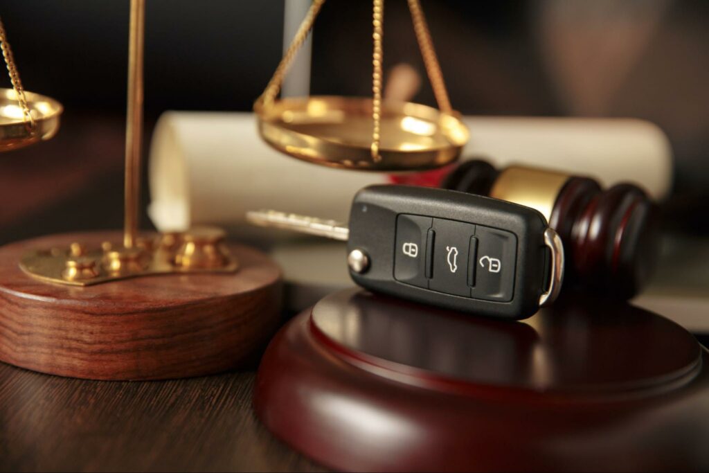 car keys sitting next to a judge's gavel
