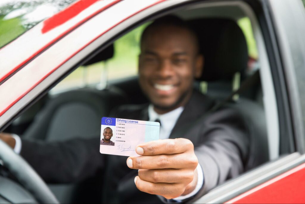 man showing his driver's license
